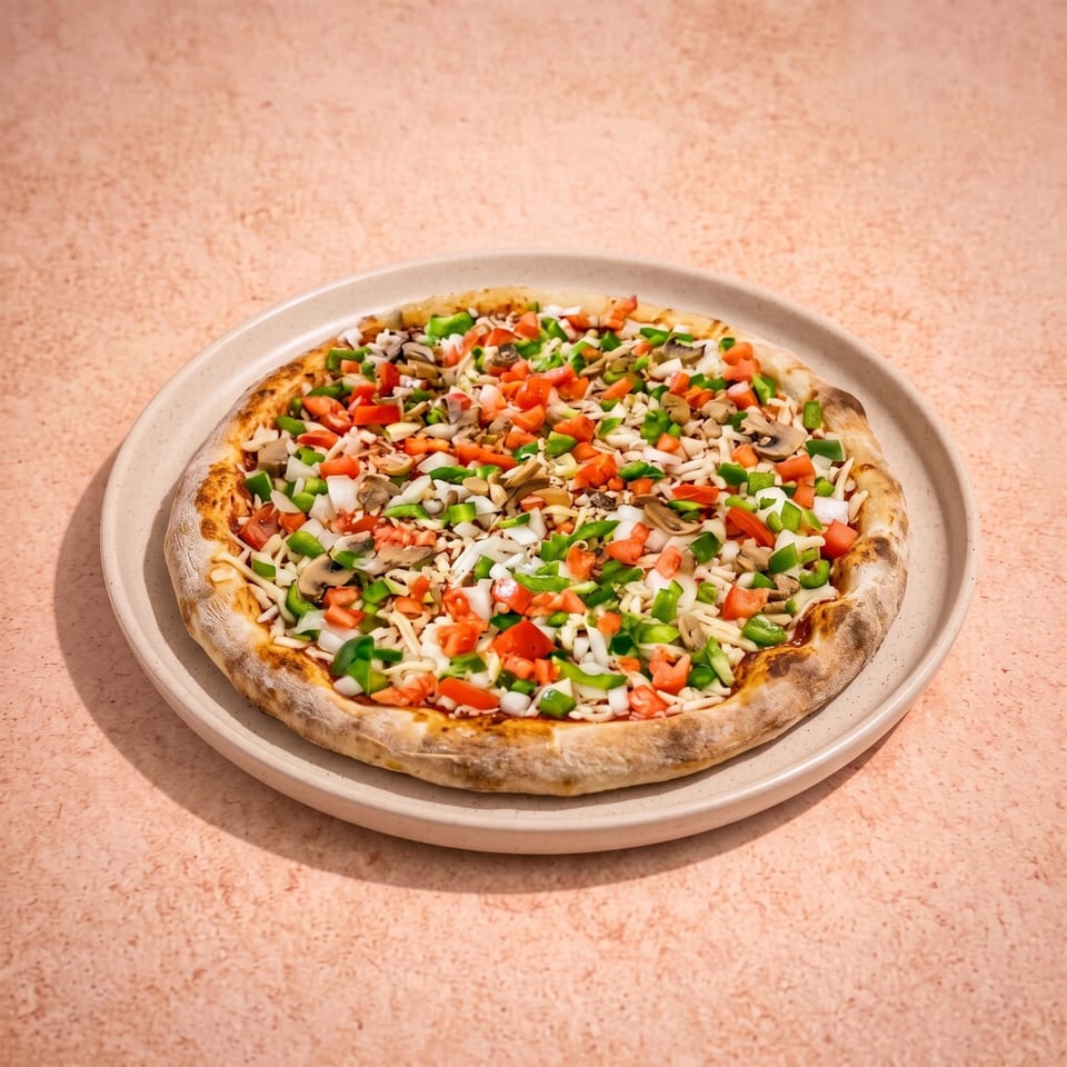 Vegetarian pizza topped with mushrooms, green peppers, tomatoes, onions, and melted cheese on a plate.